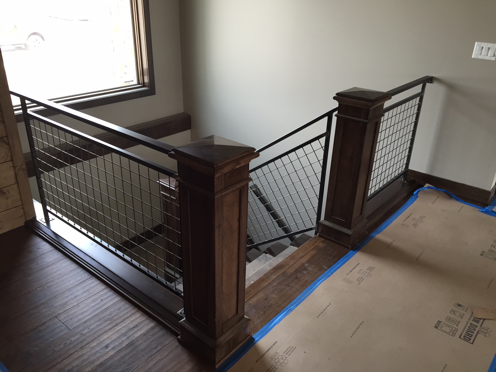 frampton_homes_des_moines_iowa_steel_mesh_railing_new_construction_custom_steel_stair_railing_fabrication_2015_1
